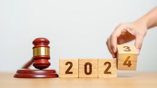 2023 chcnge to 2024 year block with judge gavel on table. Law, lawyer, judgment, justice auction and bidding concept