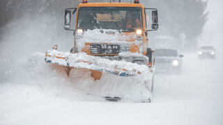 Liptov, Slovakia - JANUARY 30, 2022. The snow plow clears the way for the cars behind it.