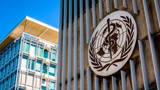 Geneva, Switzerland - September 3, 2020: The logo of the World Health Organization (WHO), a United Nations agency specialized in international public health, at the entrance of its headquarters.