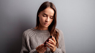 stop vape, refusal of disposable cigarettes, quit smoking teenager, teen girl looks at a ecigarette
