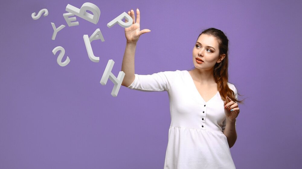 Woman working with a set of letters, writing concept. Legasthenie
