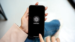 Chiang mai, Thailand - August 28th, 2025: A woman hands holding smartphone open ChatGPT application. Online Assistant, AI Chatbot, Modern Technology.