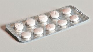 Antipyretics: Medications like acetaminophen and ibuprofen are used to reduce fever by lowering the hypothalamus's set point temperature, close-up --chaos 15 --ar 16:9 --stylize 150 --v 6 Job ID: 77b6e577-064d-451b-8567-fe4c12f247c8