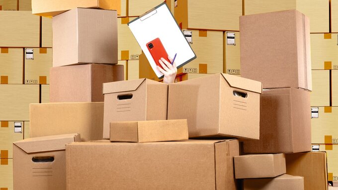 Stocktake at warehouse. Womans hand with clipboard. Chaos card boxes. Concept accounting courier boxes. Warehouse background. Stocktake boxes. Warehouse lot with chaos. Working in logistics business