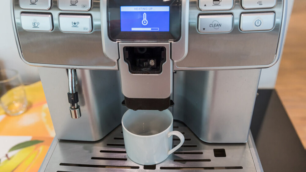 self-service coffee machines offer consistent, quality coffee in hotel, sport club or office. Espresso cappuccino coffee machine on the table. Espresso coffee pouring from espresso machine. Barista .