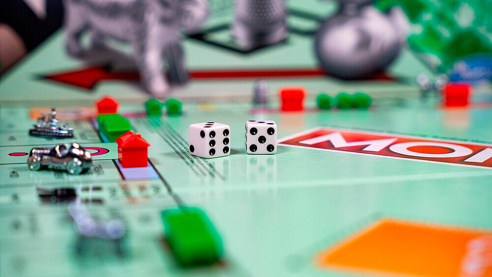 Pieces of the Monopoly board game. Monopoly is a popular multiplayer economics-themed board game. Toronto, Canada - October 5, 2024. Pieces of the Monopoly board game. Monopoly is a popular multiplayer economics-themed board game. Toronto, Canada - October 5, 2024.