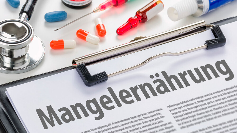 Clipboard mit der Beschriftung Mangelernährung