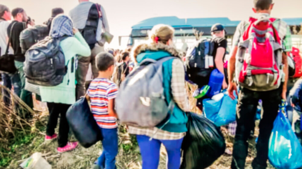 The refugees The refugees migrate to Europe. blurred, bokeh background, defocused