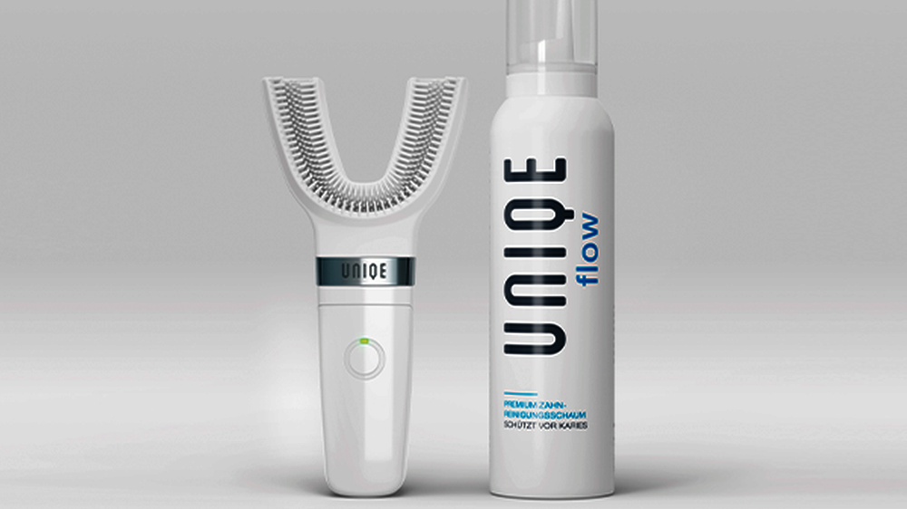 UNIQE-System aus UNIQE One Lamellenzahnbürste und UNIQE Flow Zahnschaum.