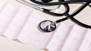 Tonometer and cardiogram showing diagnosis of atrial fibrillation, abnormal heart rhythm, arrhythmia