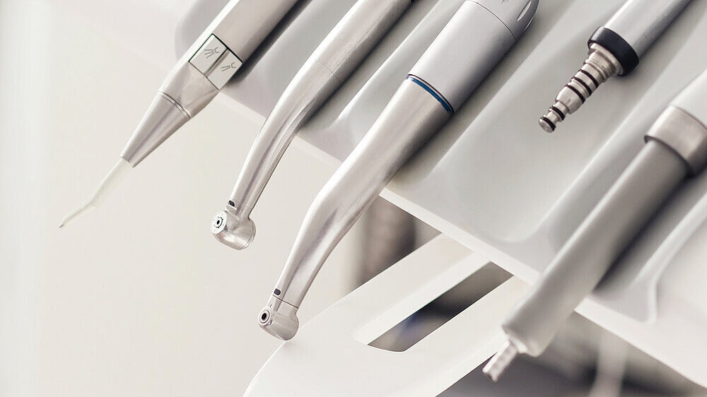 Closeup banner of a modern dentist tools, burnishers with blurred background. High quality horizontal photo from dentist room. Closeup banner of a modern dentist tools, burnishers with blurred background. High quality light horizontal photo from dentist room