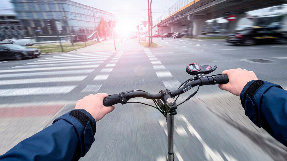 Electric scooter fast ride in the city - first-person view photo E-Scooter