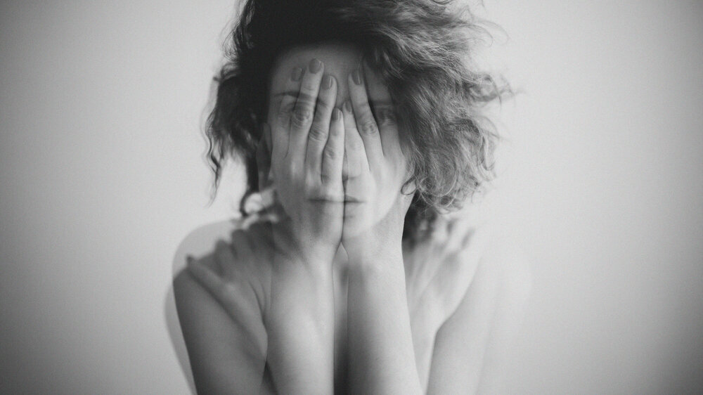 Double exposure black and white portrait of a woman covering her face and eyes with her hands Depression: Double exposure black and white portrait of a woman covering her face and eyes with her hands