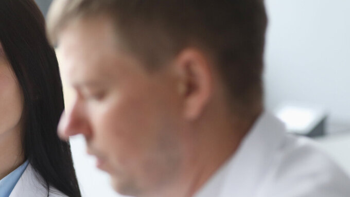 Woman dissatisfied doctor distrust looks at her colleague portrait. Incorrect treatment concept