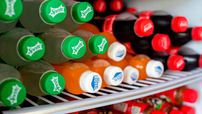 Manila, Philippines - Jan 2022: Sprite, Royal and Coke PET bottles inside a freezer. For sale at a local sari-sari store. Softdrinks