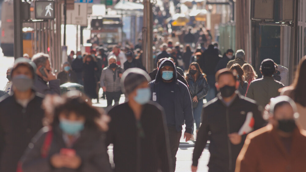 Anonymous crowd of people walking street wearing masks during covid 19 coronavirus pandemic Anonymous crowd of people walking street wearing masks during covid 19 coronavirus pandemic