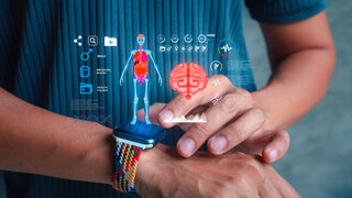 Man using a smartwatch with holographic projection of human body and brain. Concept of AI healthcare, smart wearable technology, and medical innovation.