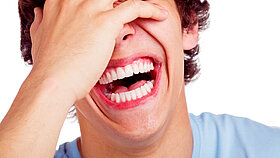 Close up portrait of hard laughing young man. Isolated on white background, mask included