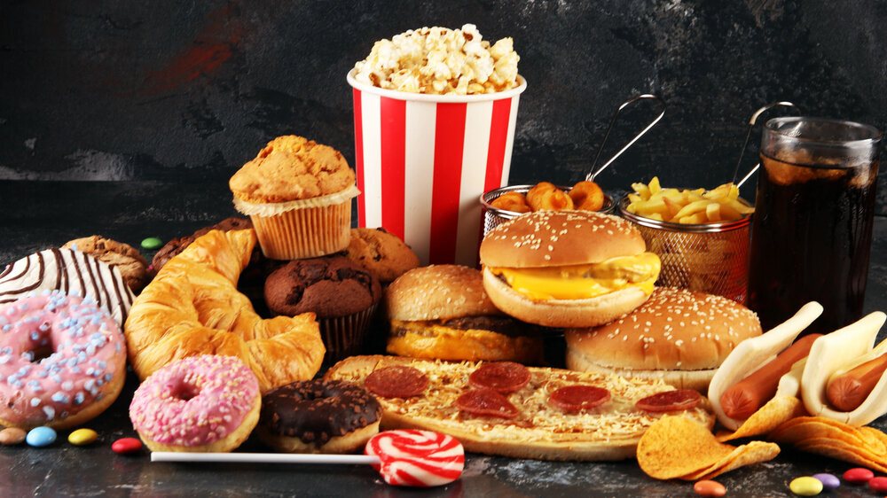 Unhealthy products. food bad for figure, skin, heart and teeth. Unhealthy products. food bad for figure, skin, heart and teeth. Assortment of fast carbohydrates food with fries and cola