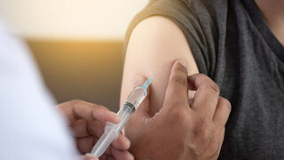 Medicine and health care concept Doctor giving patient vaccine insulin or vaccination