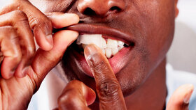 Man Chewing Wet Moist Nicotine Tobacco Snus Product