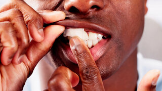 Man Chewing Wet Moist Nicotine Tobacco Snus Product