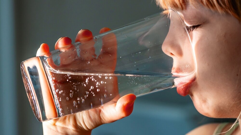 Little girl drinking a fresh glass of water Little girl drinking a fresh glass of water.