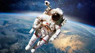 Astronaut in outer space with planet earth as backdrop. Elements of this image furnished by NASA.