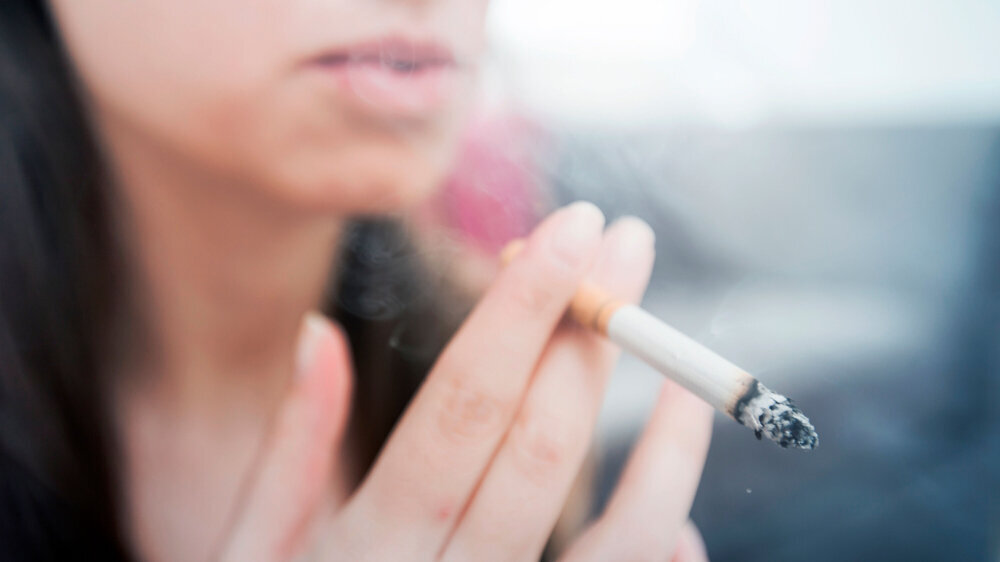 Woman Smoking Cigarette Woman smoking cigarette, unhealthy lifestyle concept, close up