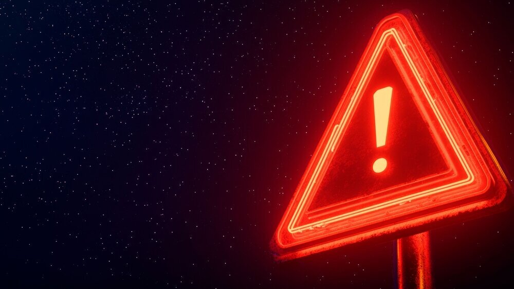 Rotes Neon-Warnschild auf schwarzem Hintergrund Rotes Neon-Warnschild auf schwarzem Hintergrund