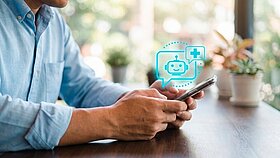 Close up of an adult man using a smartphone with a virtual AI medical chatbot icon, representing telemedicine, digital healthcare, patient support, mobile health apps, and online consultation technology.
