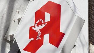 Hannover, Germany - March 16, 2020: German Apotheke - which translates as pharmacy or drugstore - with red A logo sign known as Apotheken-A