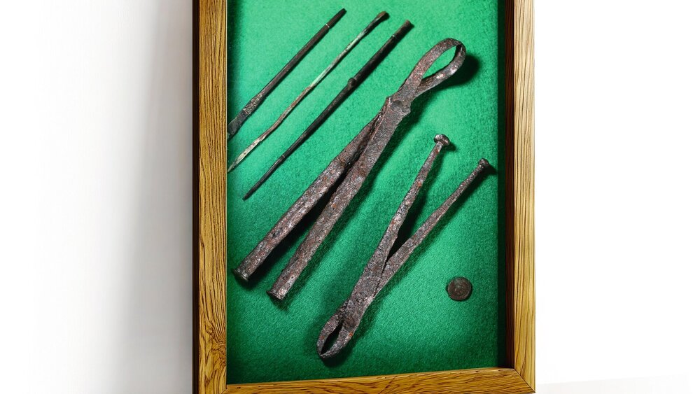 A wooden frame on a white wall with a white background.