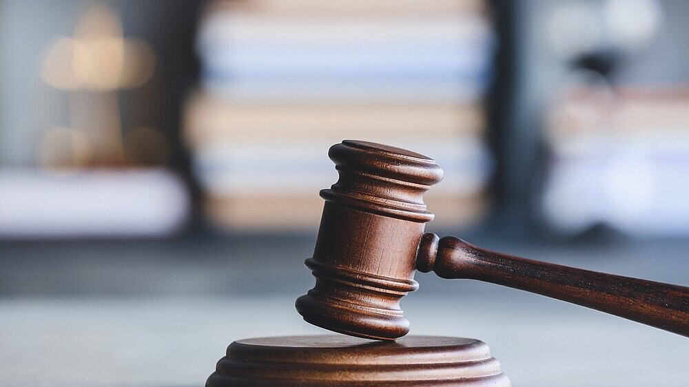 Judge's gavel on table in office