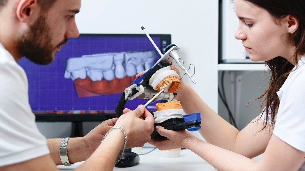 3d modelling in dental laboratory with technician engineer and dentist technician discuss 3d teeth model in laboratory