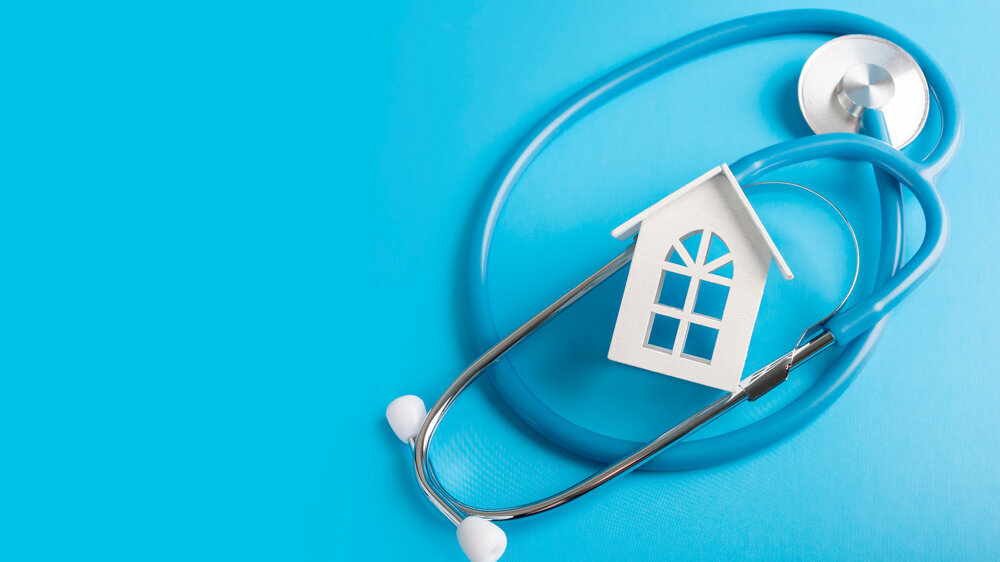 home doctor, medical clinic with home visits, ambulance, house and medical stethoscope on blue background Hausarzt