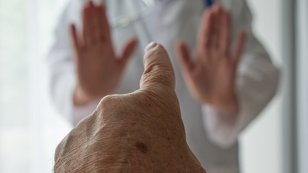 Stop medical staff abuse. Threatening behaviour towards a doctor, Physician. Angry and violent patient. Zero tolerance.