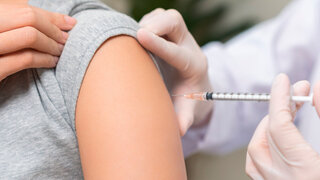 Health care, corona virus, hand of woman nurse, doctor giving syringe vaccine, injection dose on arm sick patient at clinic. Vaccination, immunization disease prevention against flu pandemic influenza