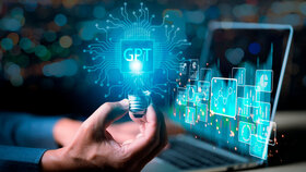 ChatGPT Chat with AI or Artificial Intelligence. Young businessman chatting with a smart AI or artificial intelligence using an artificial intelligence chatbot developed by OpenAI.