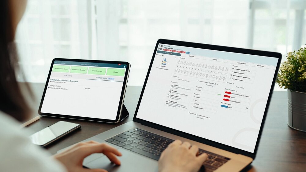 Woman using digital laptop and tablet with smartphone on the table in house. Blank screen for advertising