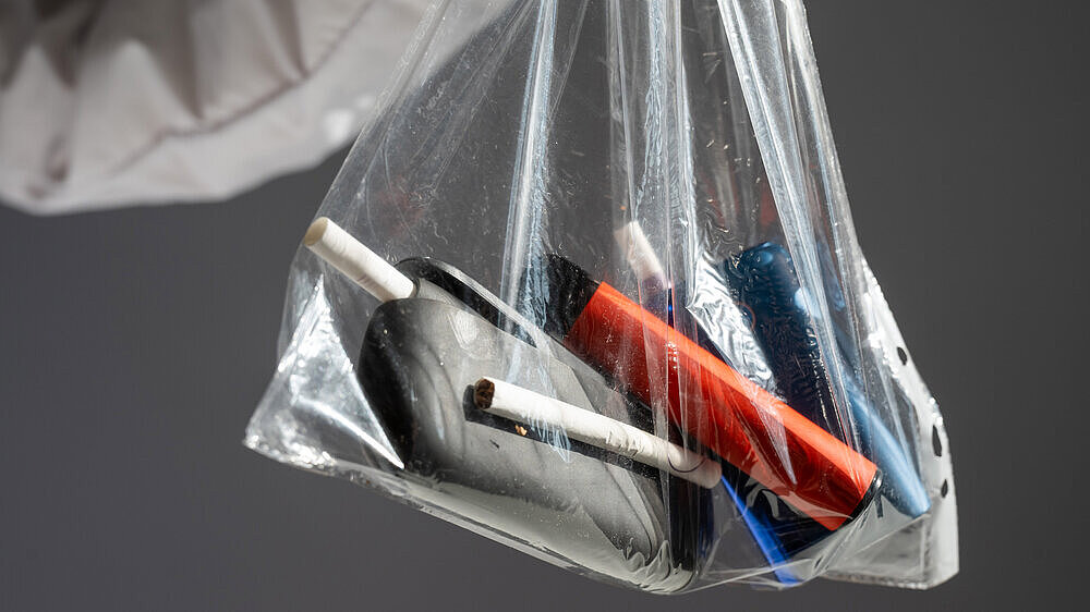 Electronic cigarettes and disposable vapes in a bag. Electronic cigarettes and disposable vapes in a bag