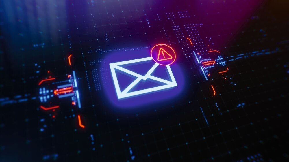 Message with warning icon on a digital LCD display with reflection. Message with warning icon on a digital LCD display with reflection. Concept of cyber attack, malware, data breach, system hacking, virus, spyware, compromised information and urgent attention.