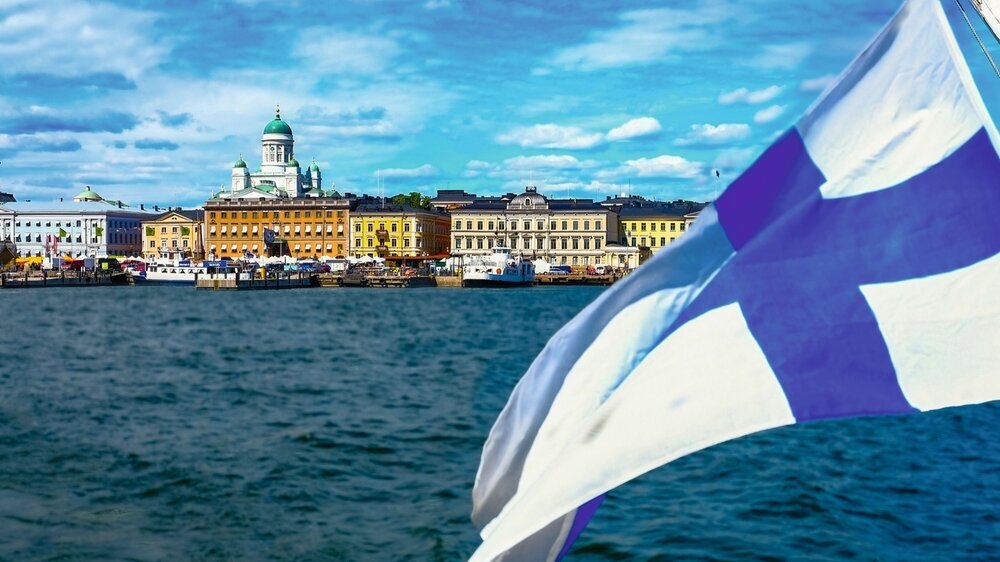 Helsinki, Finland 8.6.2018 Market Square and Helsinki Cathedral and Finland flag