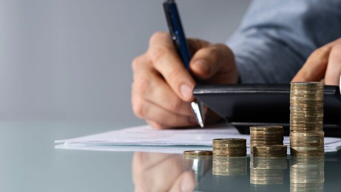 Tooth In Front Of Businessperson Calculating Bill iMVZ